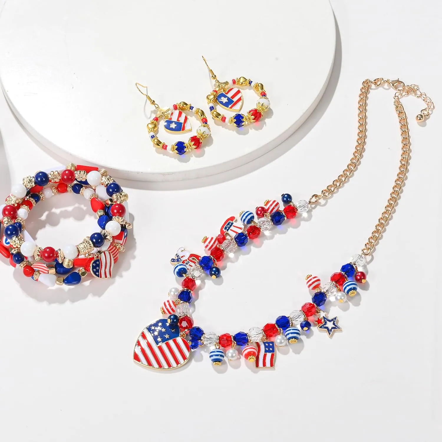 Shine on Independence Day! Embrace American pride with a Star-spangled Pendant Necklace, an Elegant Charmed Letter Bracelet, and Sparkling Star Earrings - A Trendy Patriotic Trio!